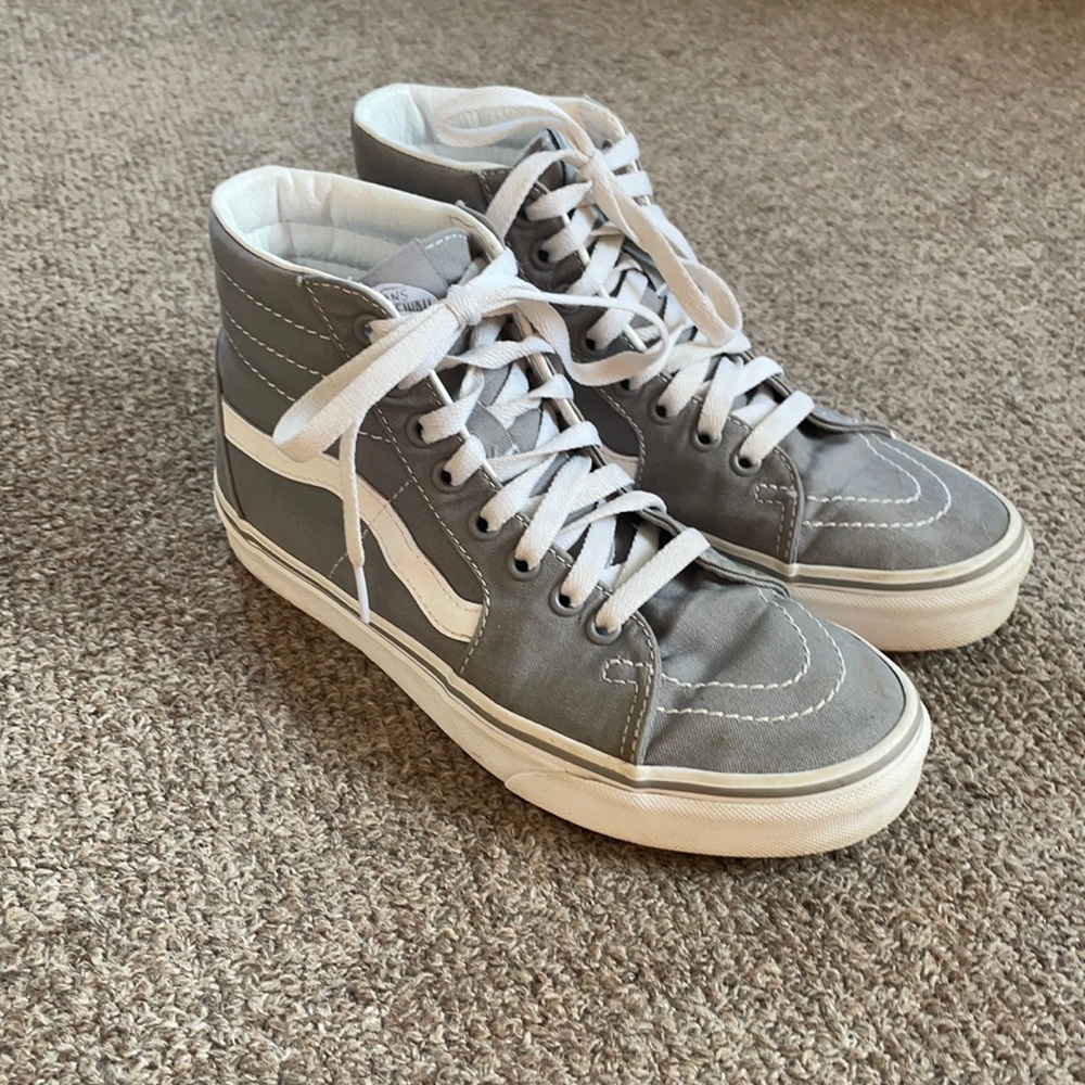 Woman’s grey high top vans